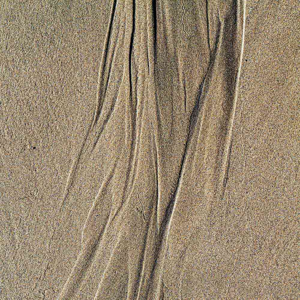 strands | Patterns in sand, left by the tide, and shadows on a Breton beach