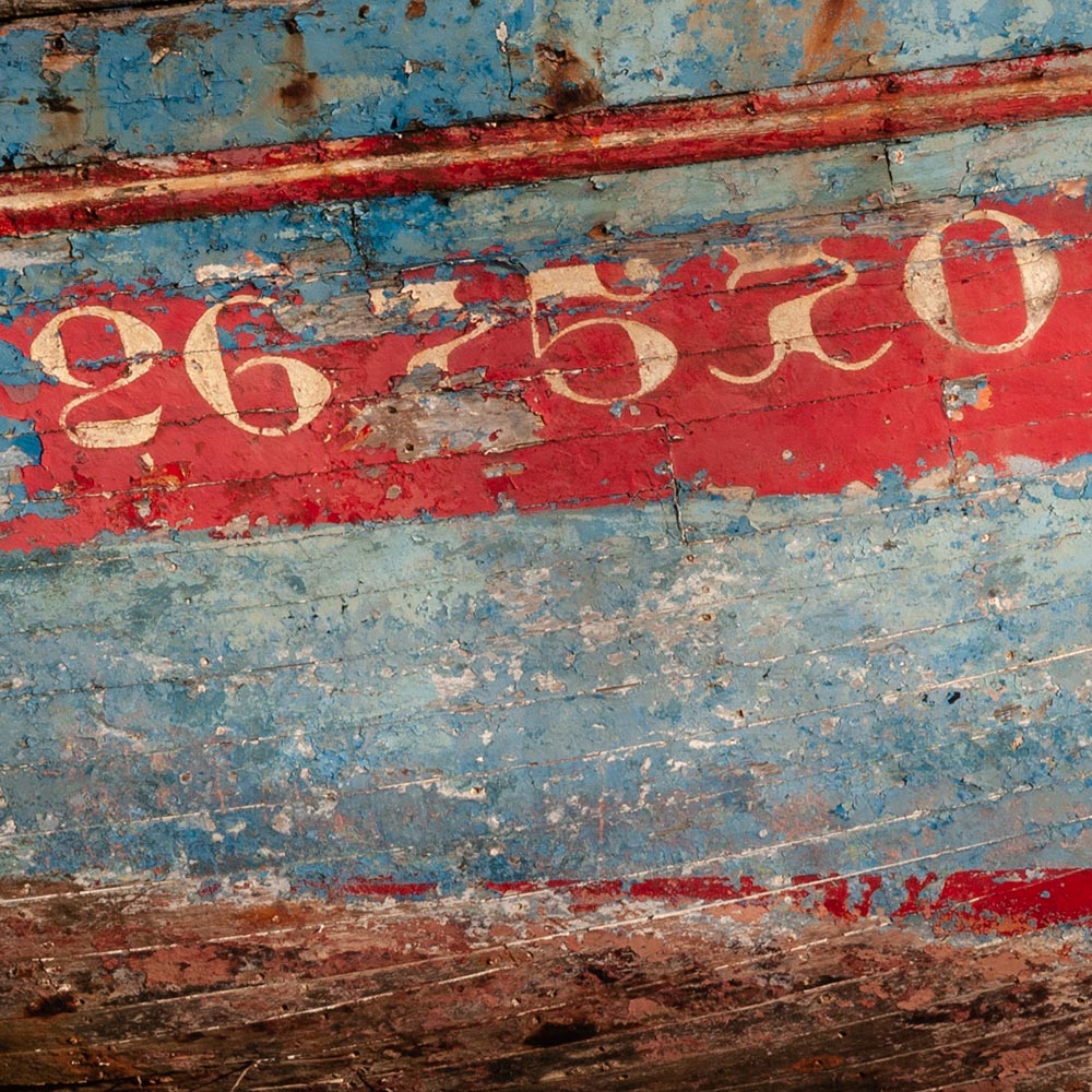 Camaret-sur_mer | a ships registration number in Breton script on the side of a rotting hulk of a fishing boat